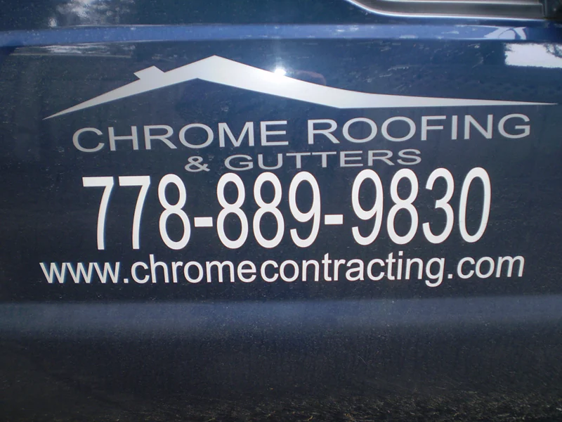 Cut vinyl lettering and logo applied to a work truck door